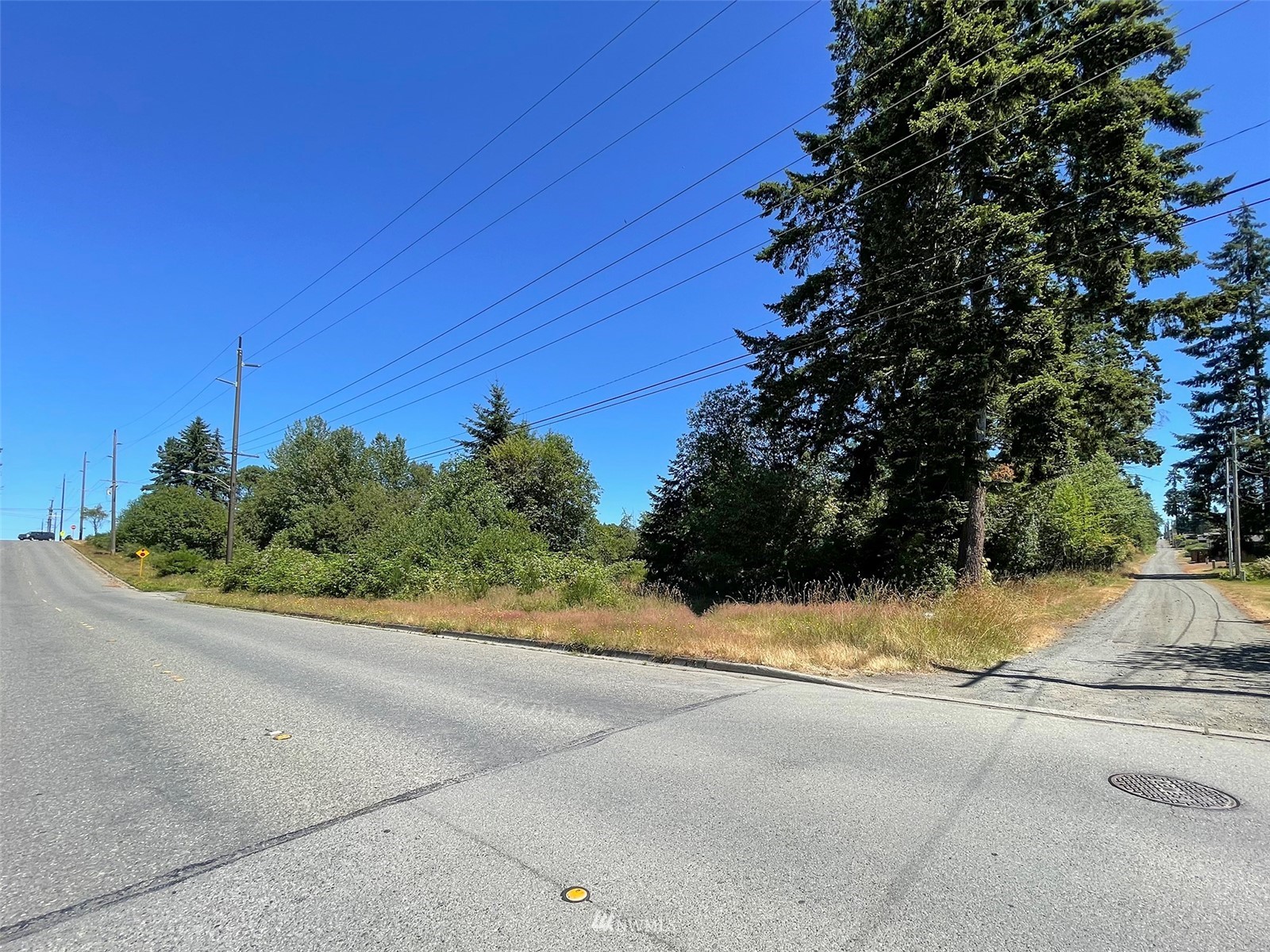 0 West 8th Street Port Angeles, WA 98363 - Photo 28 of 40 a view of a street with a house in background