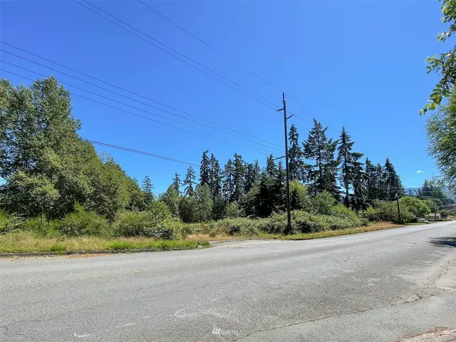 a view of a road with a houses