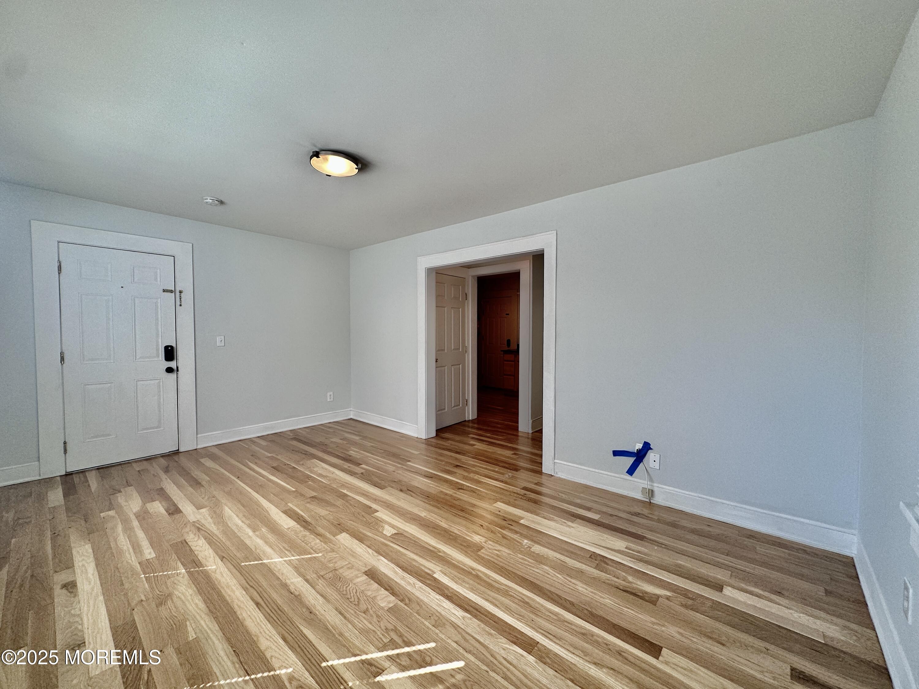 1004 5th Avenue, Unit 1N Asbury Park, NJ 07712 - Photo 4 of 14 a view of a room with a flat screen tv