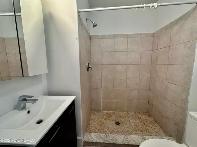 a bathroom with a sink and shower
