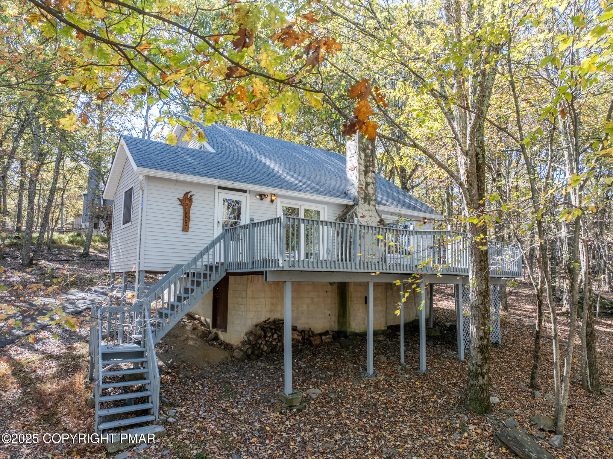 a backyard of a house with table and chairs