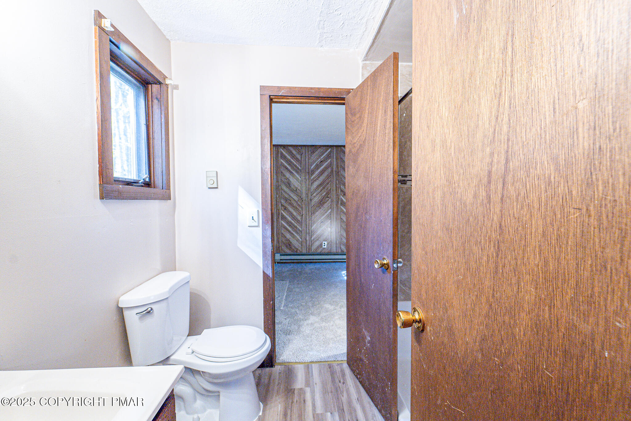 1562 Oak Lane Bushkill, PA 18324 - Photo 14 of 27 a bathroom with a toilet and a shower curtain