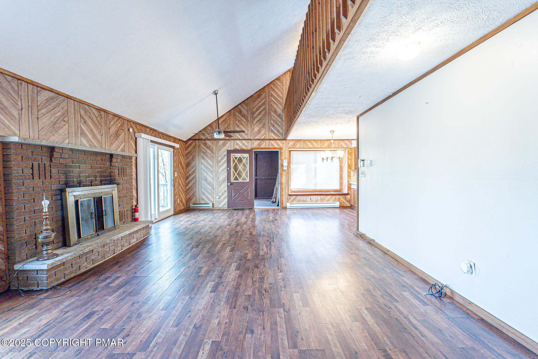 1562 Oak Lane Bushkill, PA 18324 - Photo 17 of 27 a view of a house with an entryway and wooden floor
