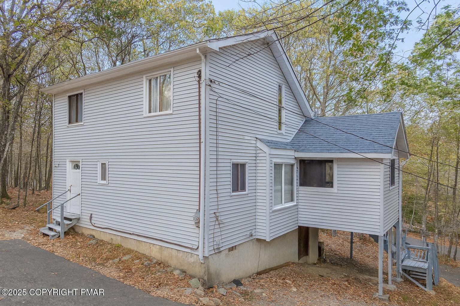 1562 Oak Lane Bushkill, PA 18324 - Photo 27 of 27 a view of a house with a yard and wooden fence