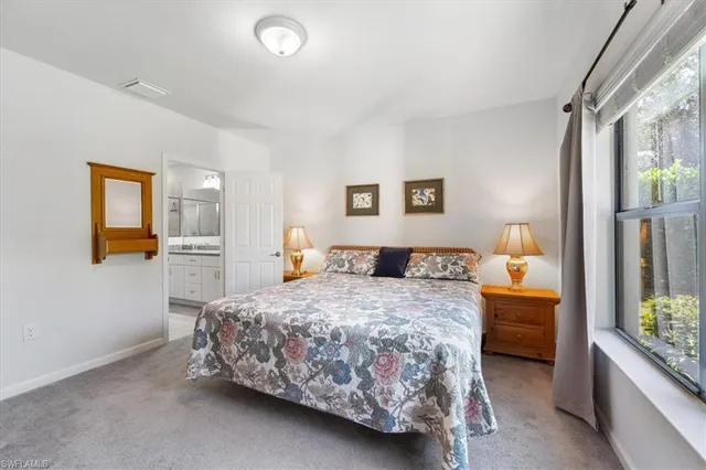 a bedroom with a bed and a cabinets