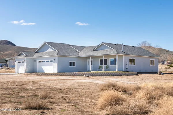 a house with trees in the background