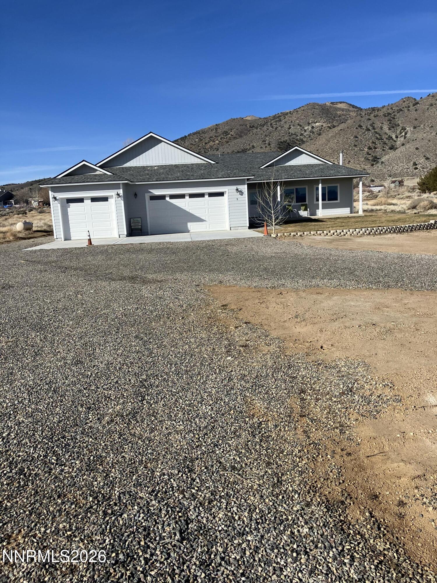 5 Pit Road Wellington, NV 89444 - Photo 19 of 38 a front view of a house with a garden