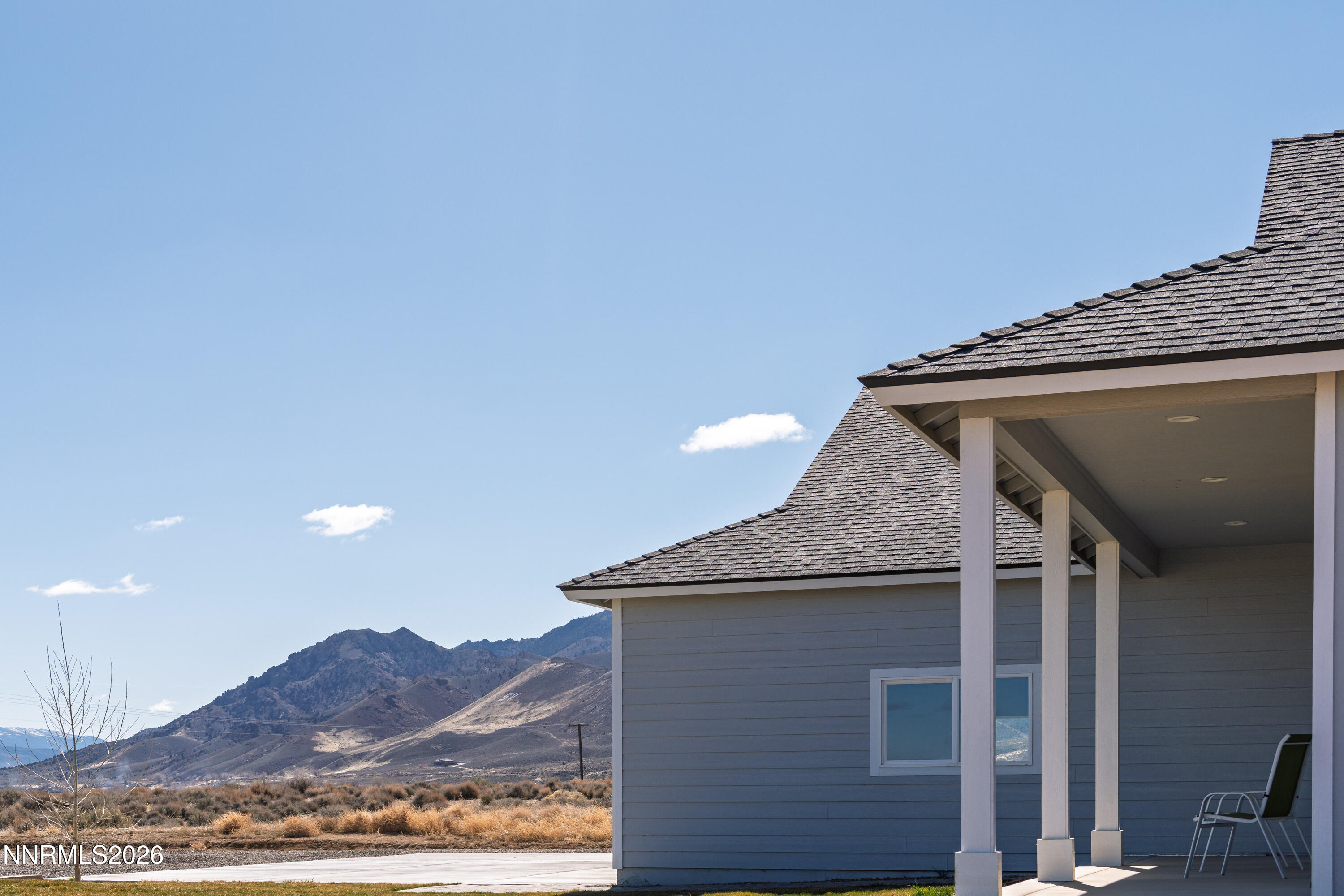 5 Pit Road Wellington, NV 89444 - Photo 20 of 51 a front view of a house with a mountain