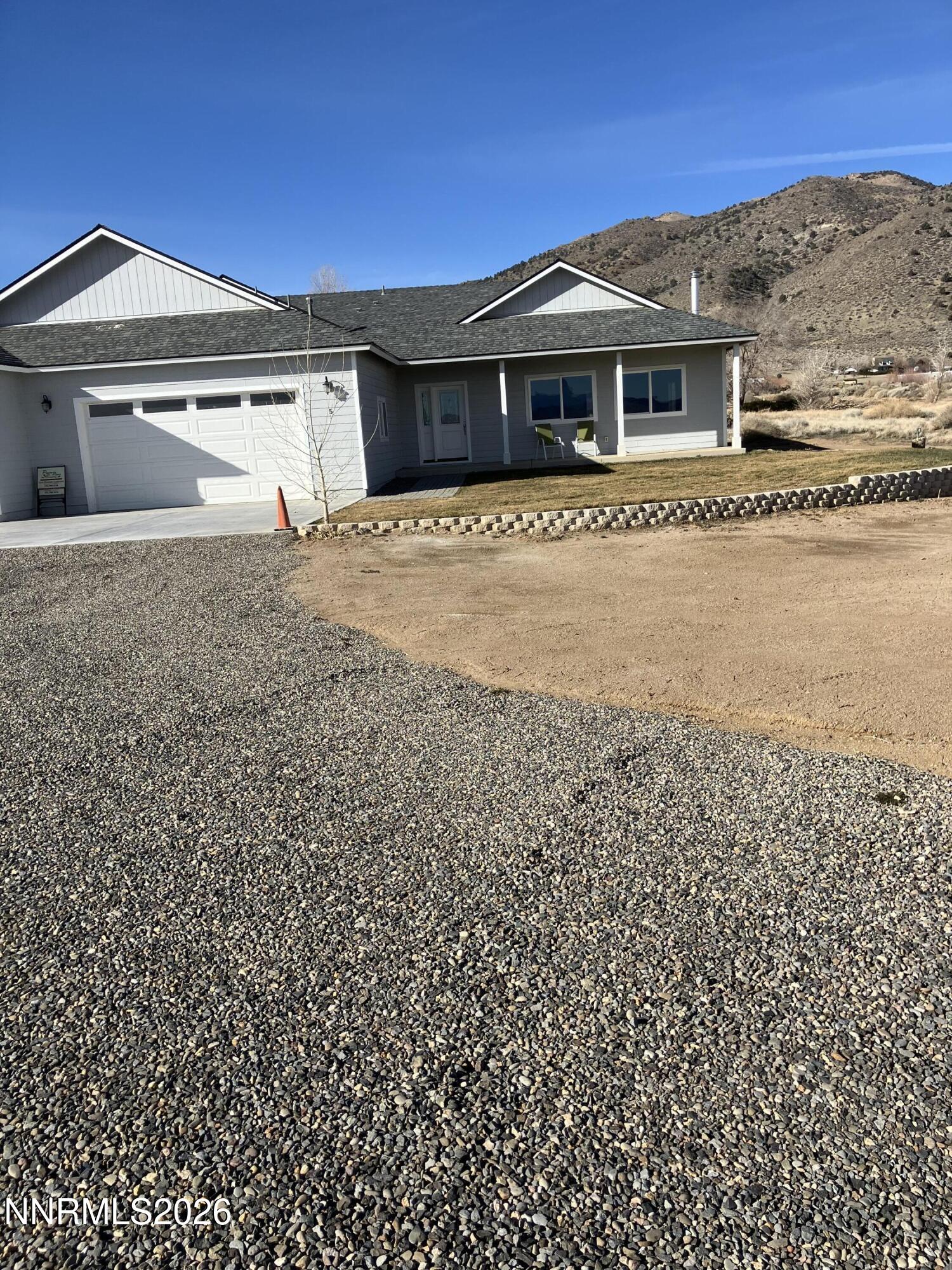 5 Pit Road Wellington, NV 89444 - Photo 21 of 38 a front view of a house with a yard