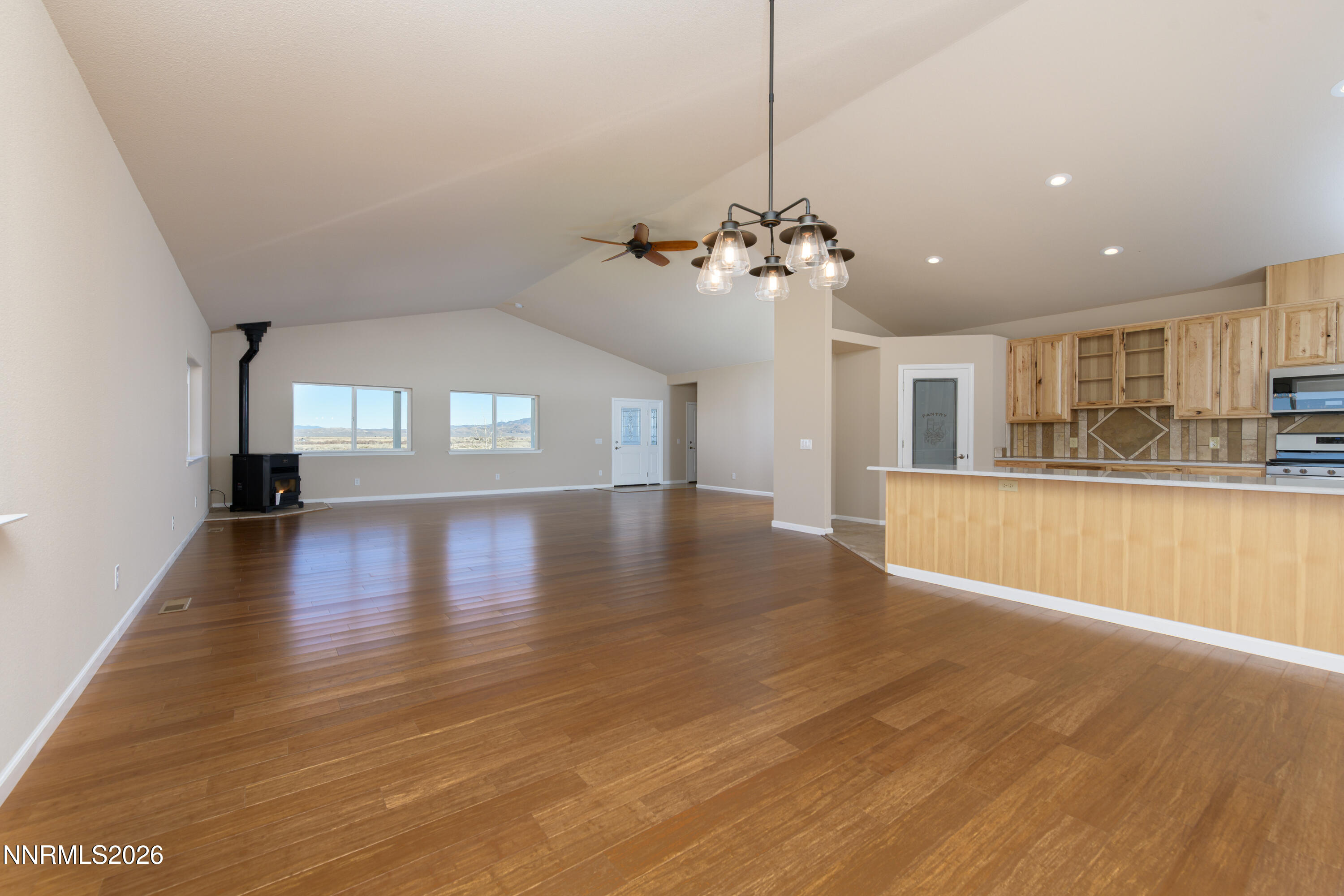 5 Pit Road Wellington, NV 89444 - Photo 29 of 51 a view of a big room with wooden floor and a kitchen
