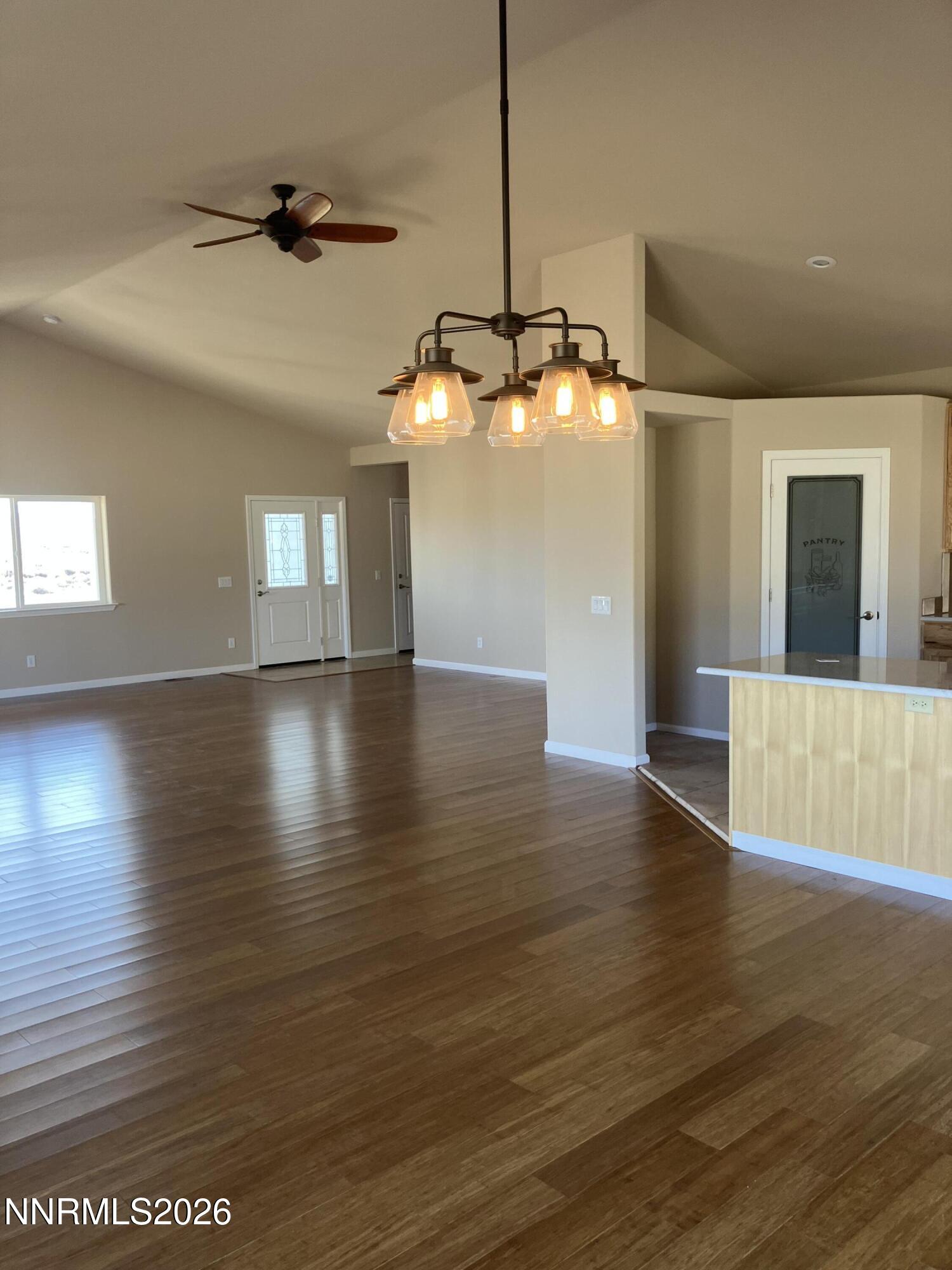 5 Pit Road Wellington, NV 89444 - Photo 3 of 38 a view of an empty room with window and wooden floor
