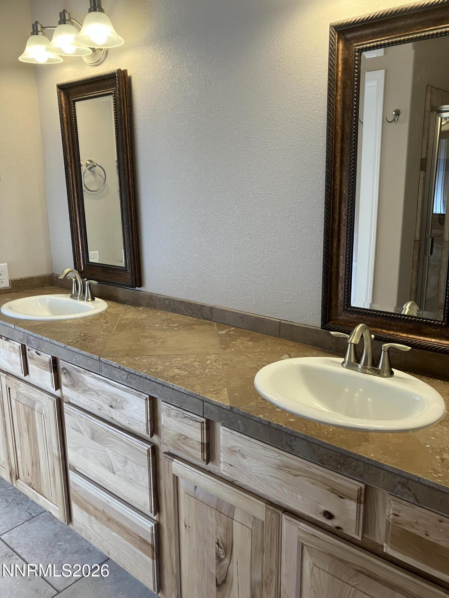 5 Pit Road Wellington, NV 89444 - Photo 34 of 38 a bathroom with a sink and a mirror