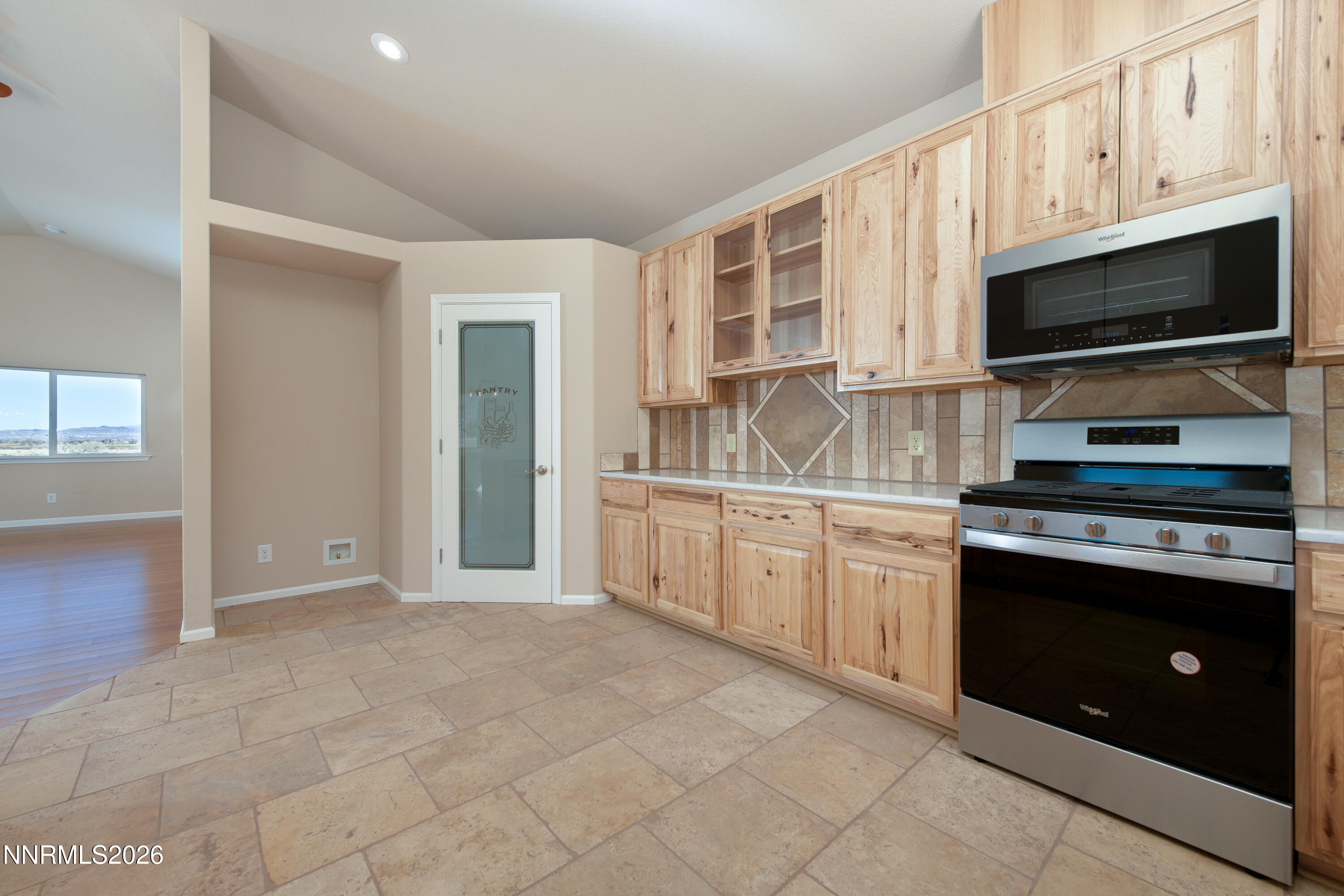 5 Pit Road Wellington, NV 89444 - Photo 35 of 51 a kitchen with stainless steel appliances granite countertop a stove microwave and cabinets