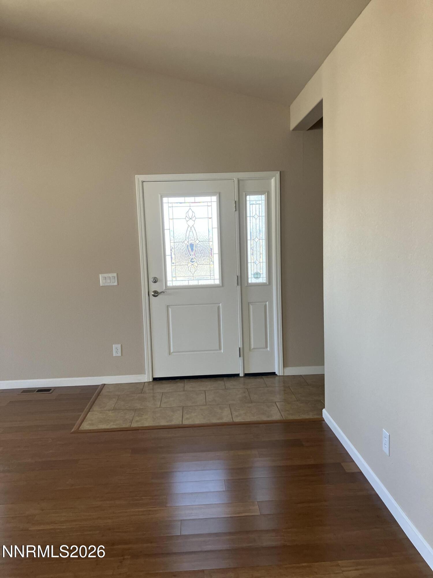5 Pit Road Wellington, NV 89444 - Photo 35 of 38 an empty room with wooden floor and windows