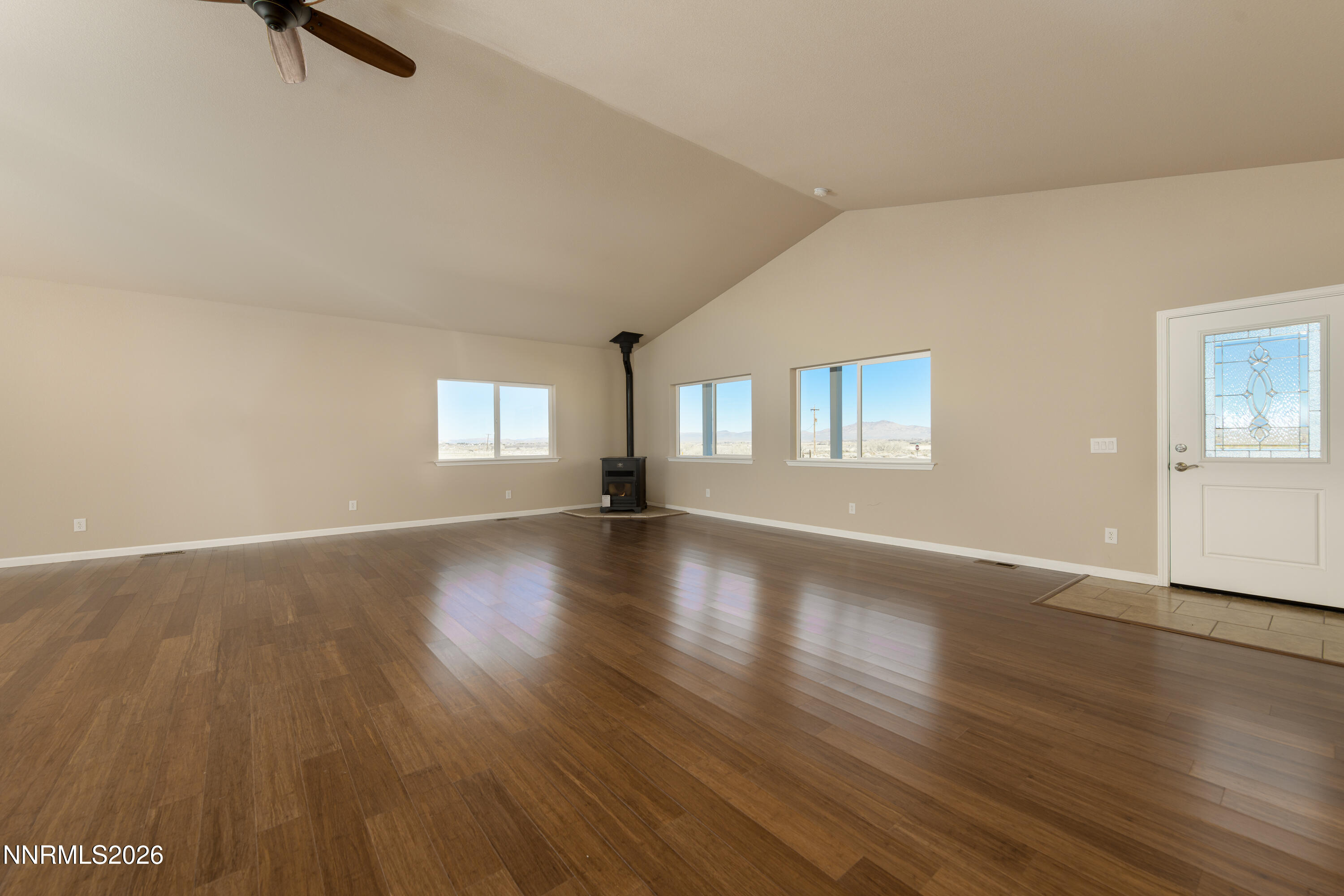 5 Pit Road Wellington, NV 89444 - Photo 36 of 51 an empty room with wooden floor and windows