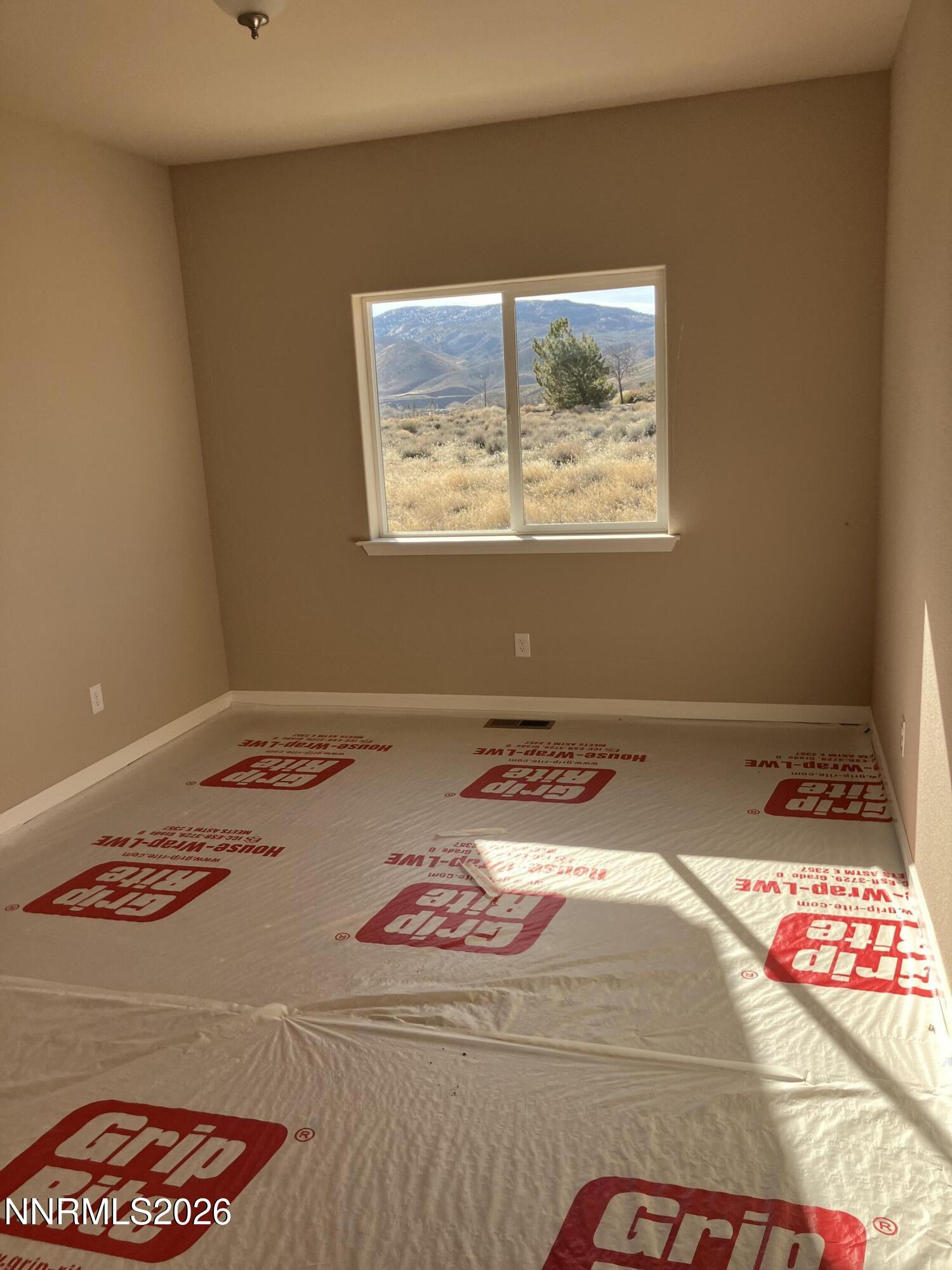 5 Pit Road Wellington, NV 89444 - Photo 36 of 38 a bedroom with a bed and a painting on the wall