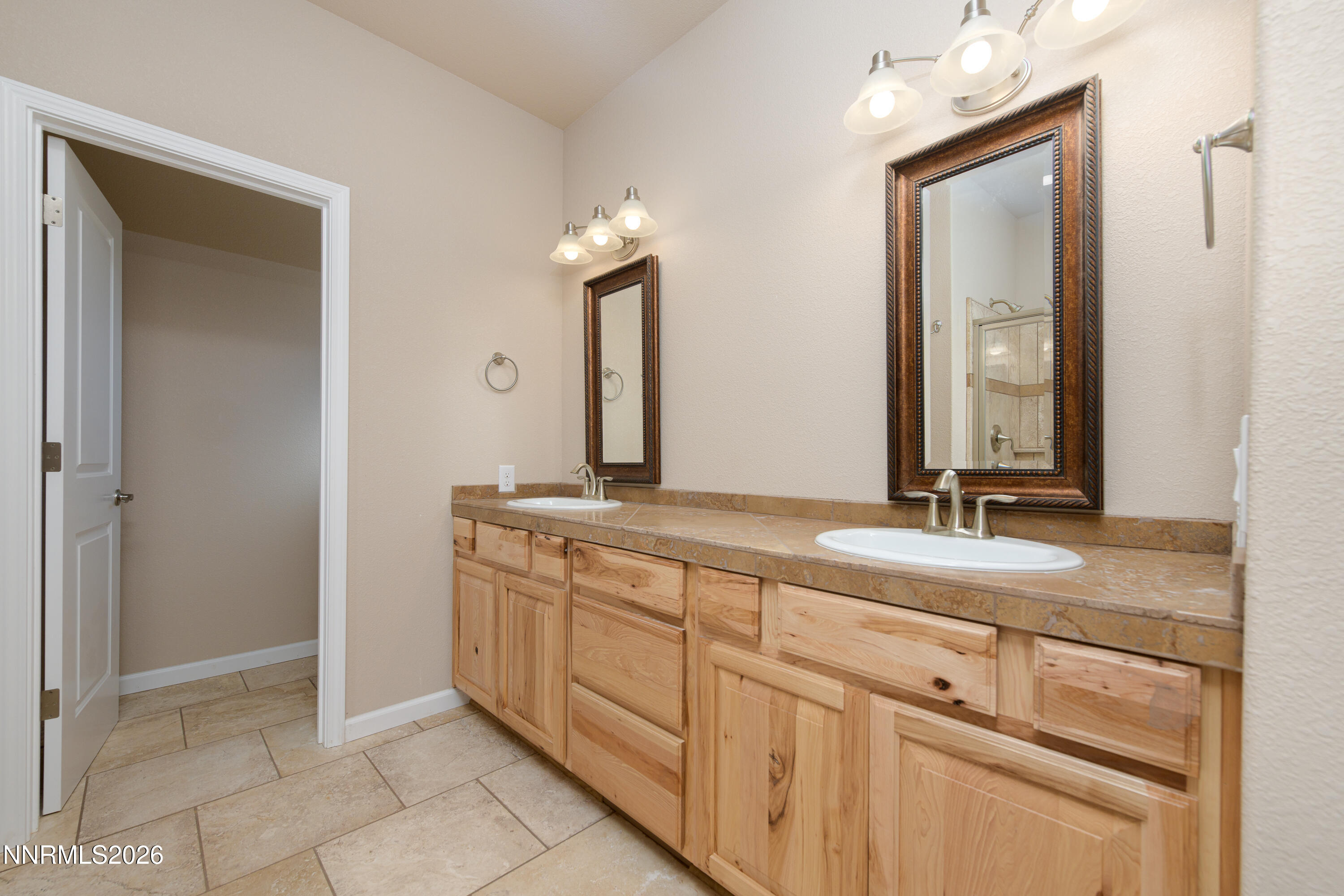 5 Pit Road Wellington, NV 89444 - Photo 44 of 51 a bathroom with a double vanity sink and a mirror