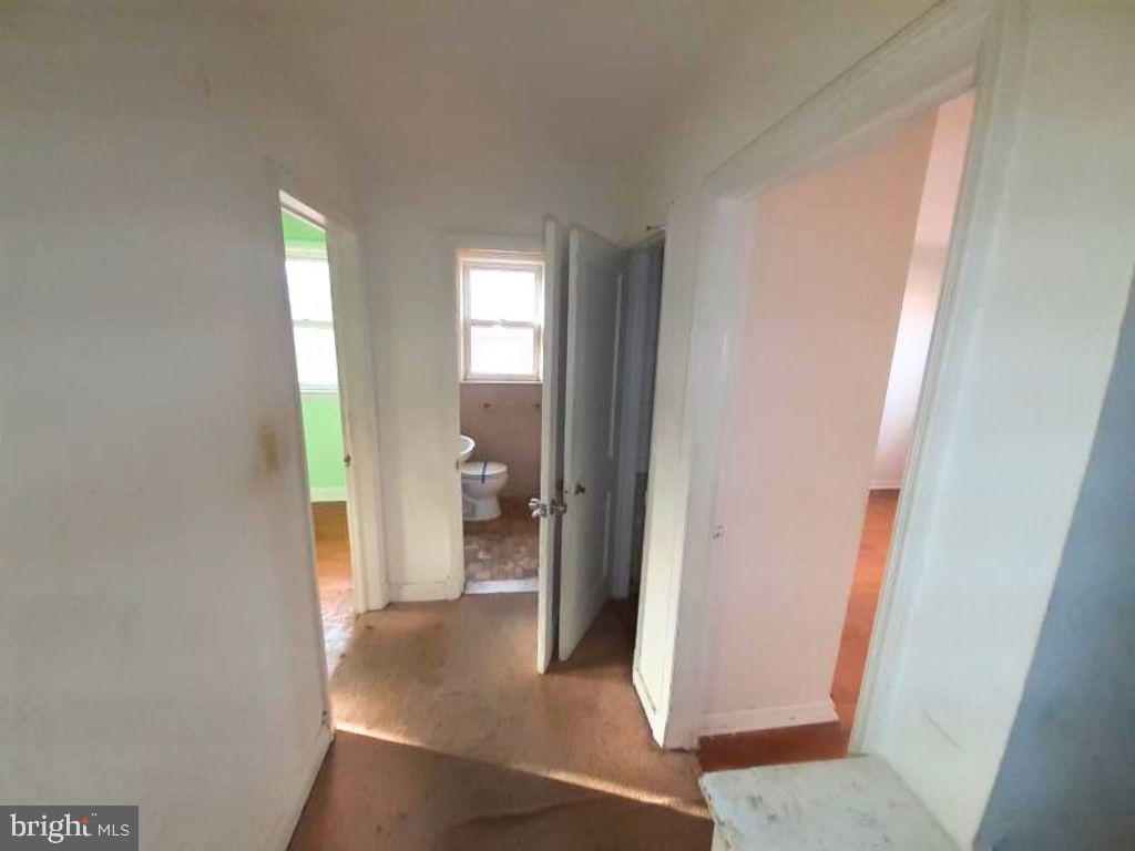 5619 Wesley Avenue Baltimore, MD 21207 - Photo 19 of 29 a view of a bathroom from a hallway