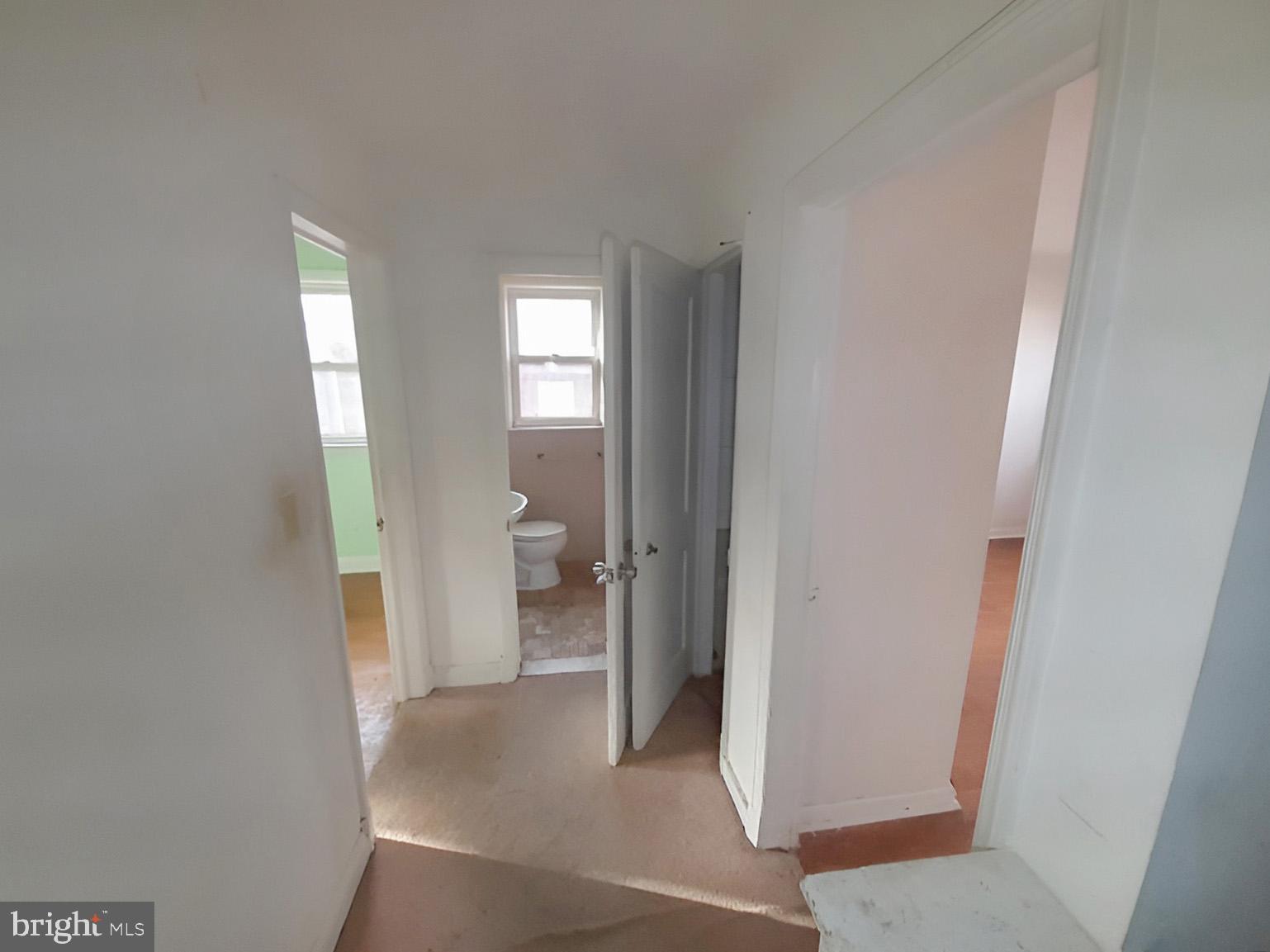 5619 Wesley Avenue Baltimore, MD 21207 - Photo 21 of 39 a view of a bathroom from a hallway