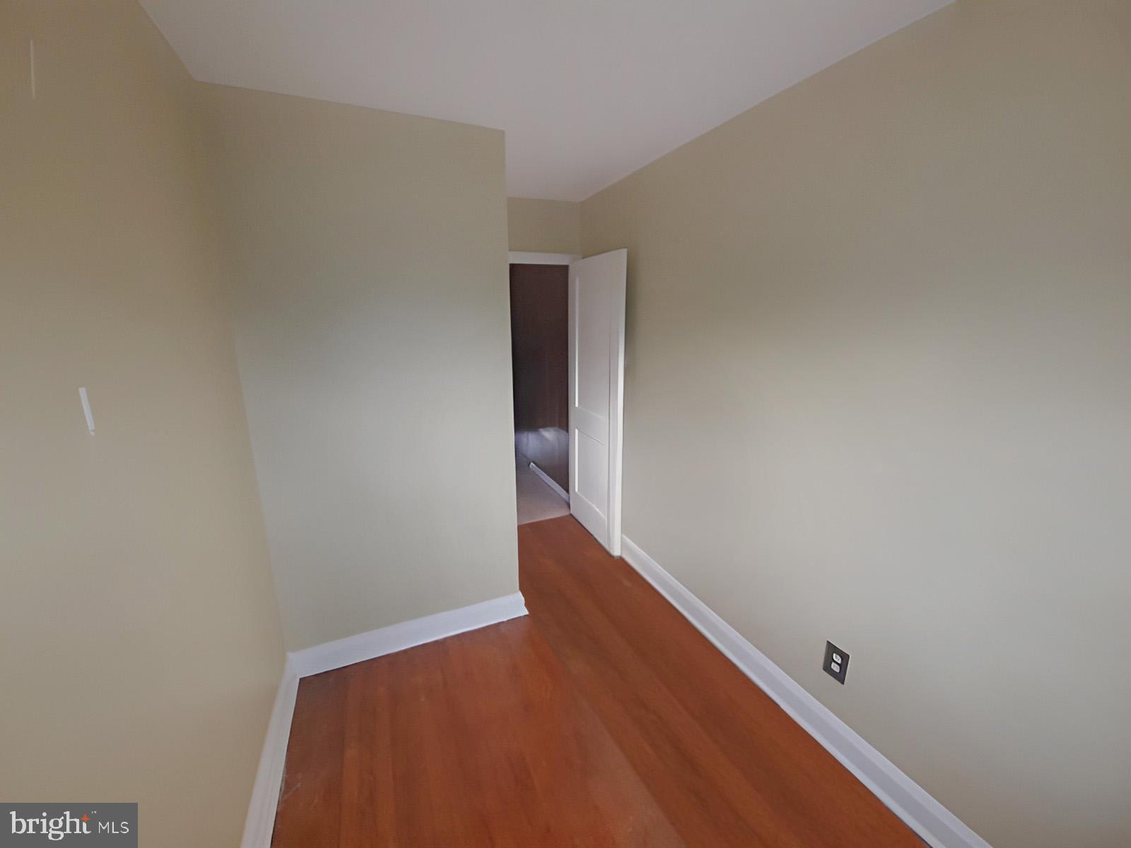 5619 Wesley Avenue Baltimore, MD 21207 - Photo 23 of 39 a view of hallway with wooden floor