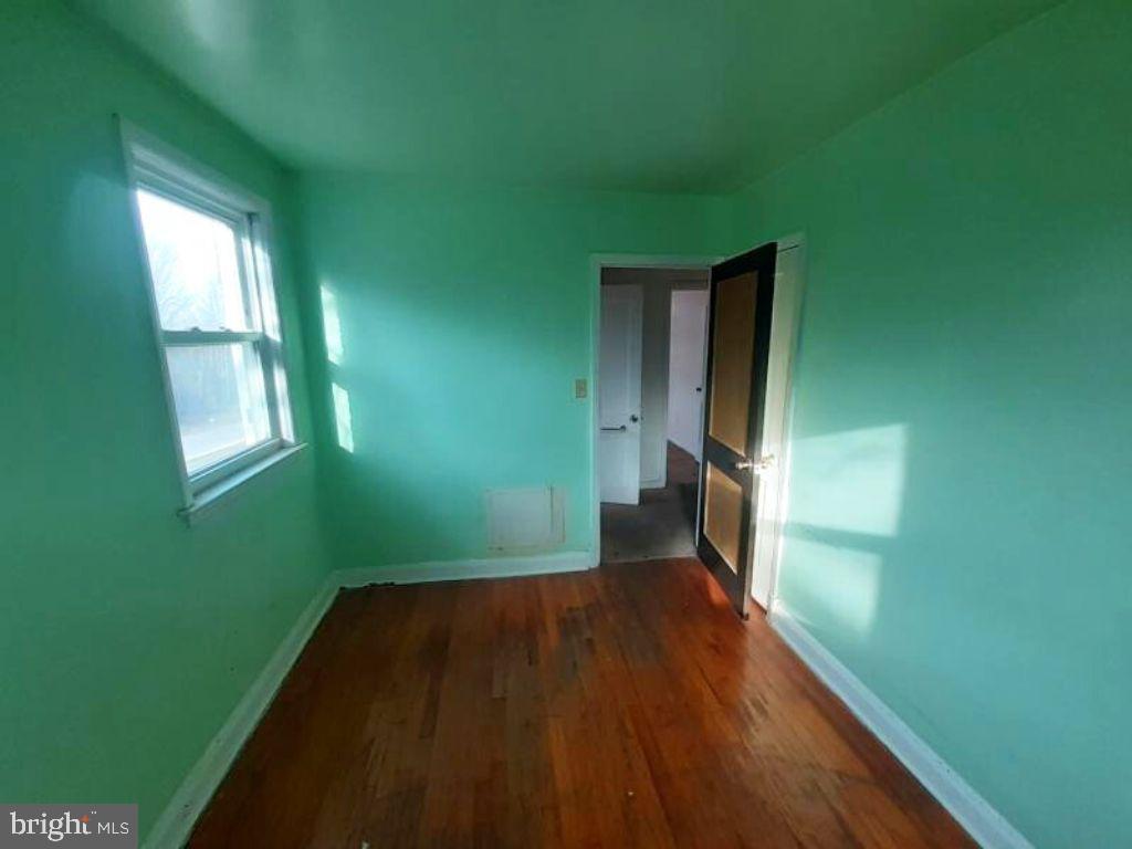 5619 Wesley Avenue Baltimore, MD 21207 - Photo 23 of 29 a view of a room that has a window
