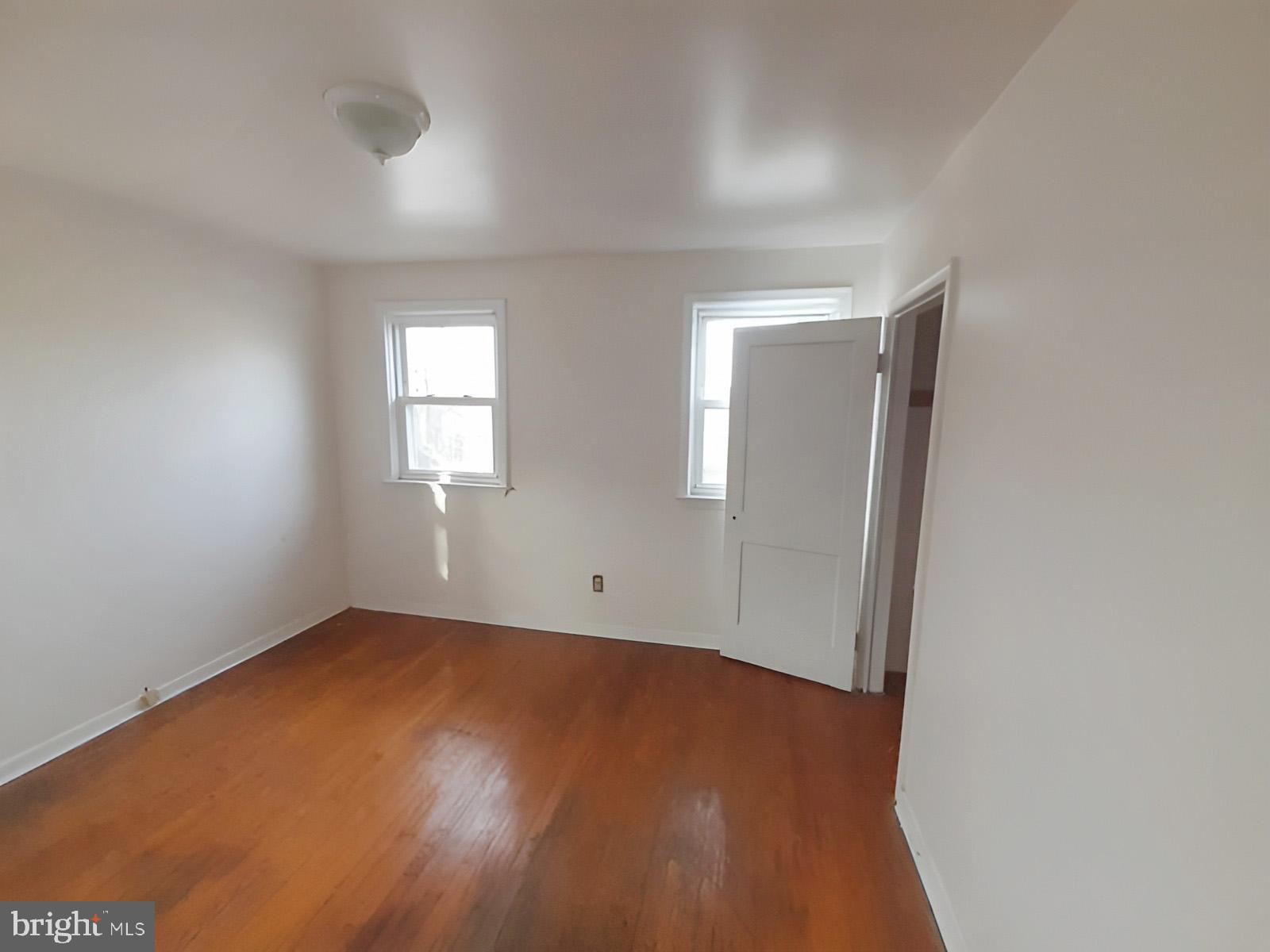 5619 Wesley Avenue Baltimore, MD 21207 - Photo 29 of 39 an empty room with windows and closet