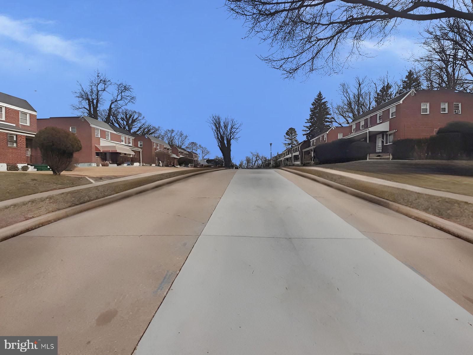 5619 Wesley Avenue Baltimore, MD 21207 - Photo 34 of 39 a view of a street with a building in the background