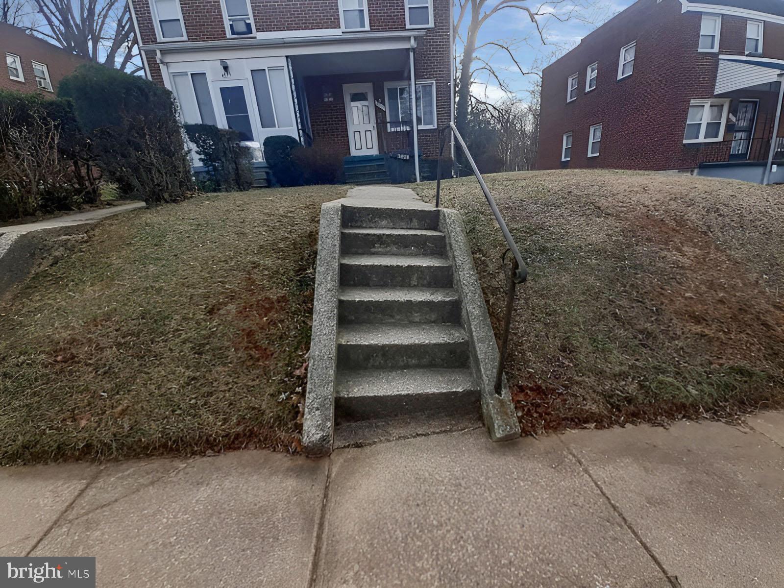 5619 Wesley Avenue Baltimore, MD 21207 - Photo 35 of 39 a view of a building with a yard