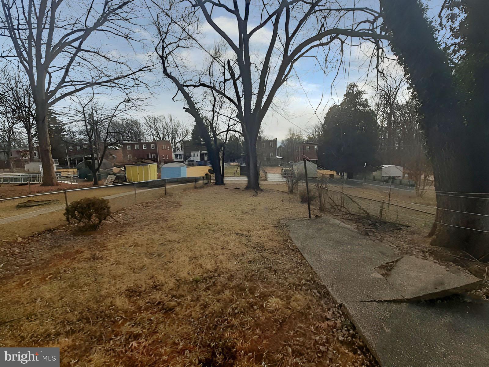 5619 Wesley Avenue Baltimore, MD 21207 - Photo 36 of 39 a view of a yard with a tree