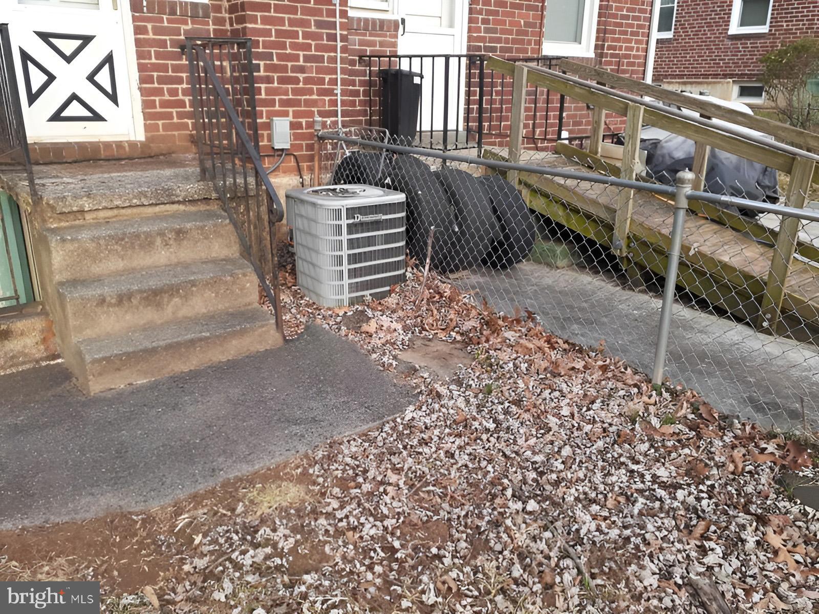 5619 Wesley Avenue Baltimore, MD 21207 - Photo 37 of 39 a view of a pathway with a building in the background
