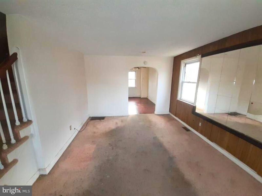 5619 Wesley Avenue Baltimore, MD 21207 - Photo 5 of 29 a view of empty room with front door