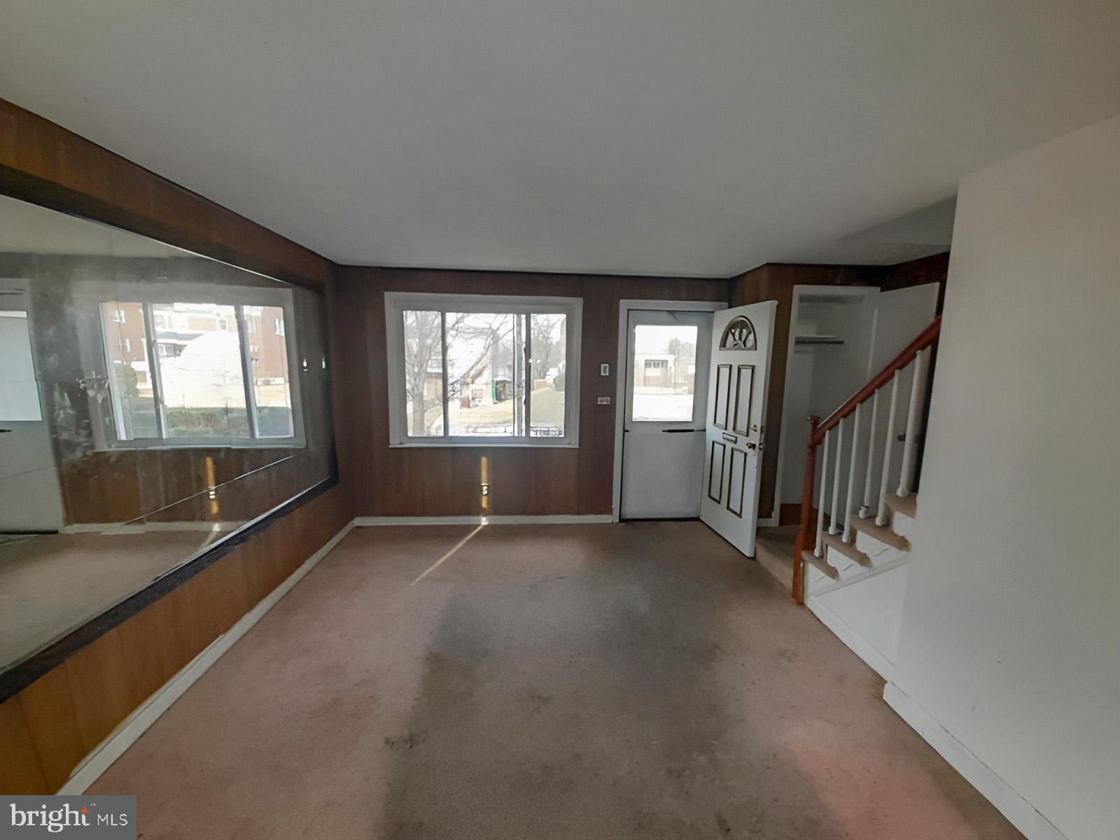 5619 Wesley Avenue Baltimore, MD 21207 - Photo 5 of 39 an empty room with windows