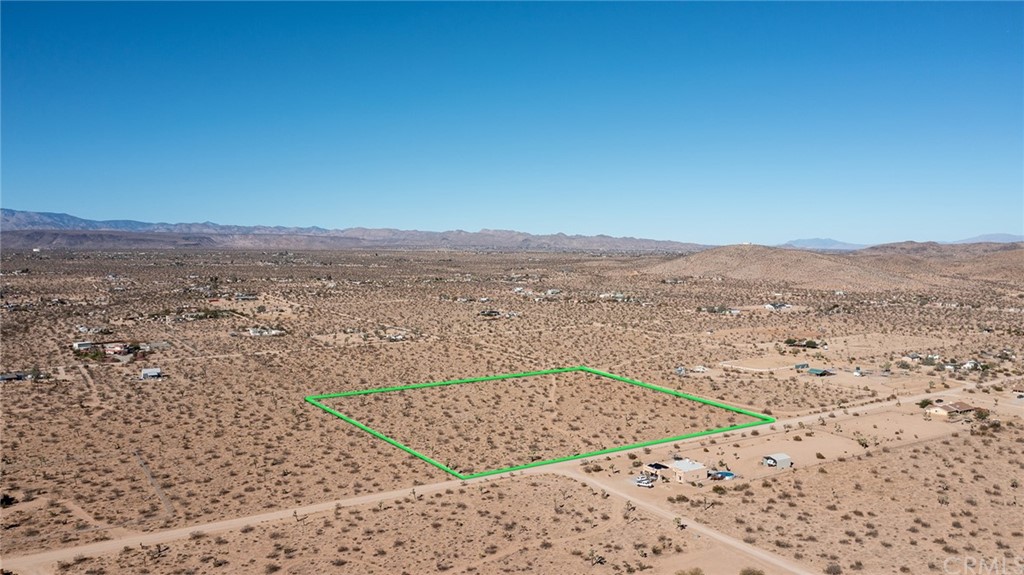 3100 Olympic Road Joshua Tree, CA 92252 - Photo 1 of 1 a view of an ocean beach and mountain
