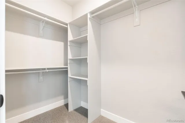 a view of an empty walk in closet