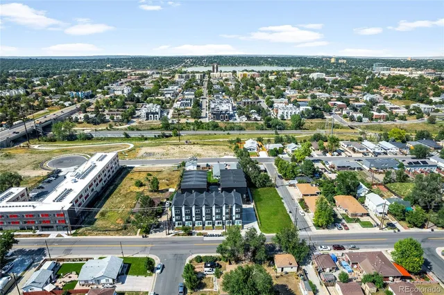 an aerial view of a city with a lake view