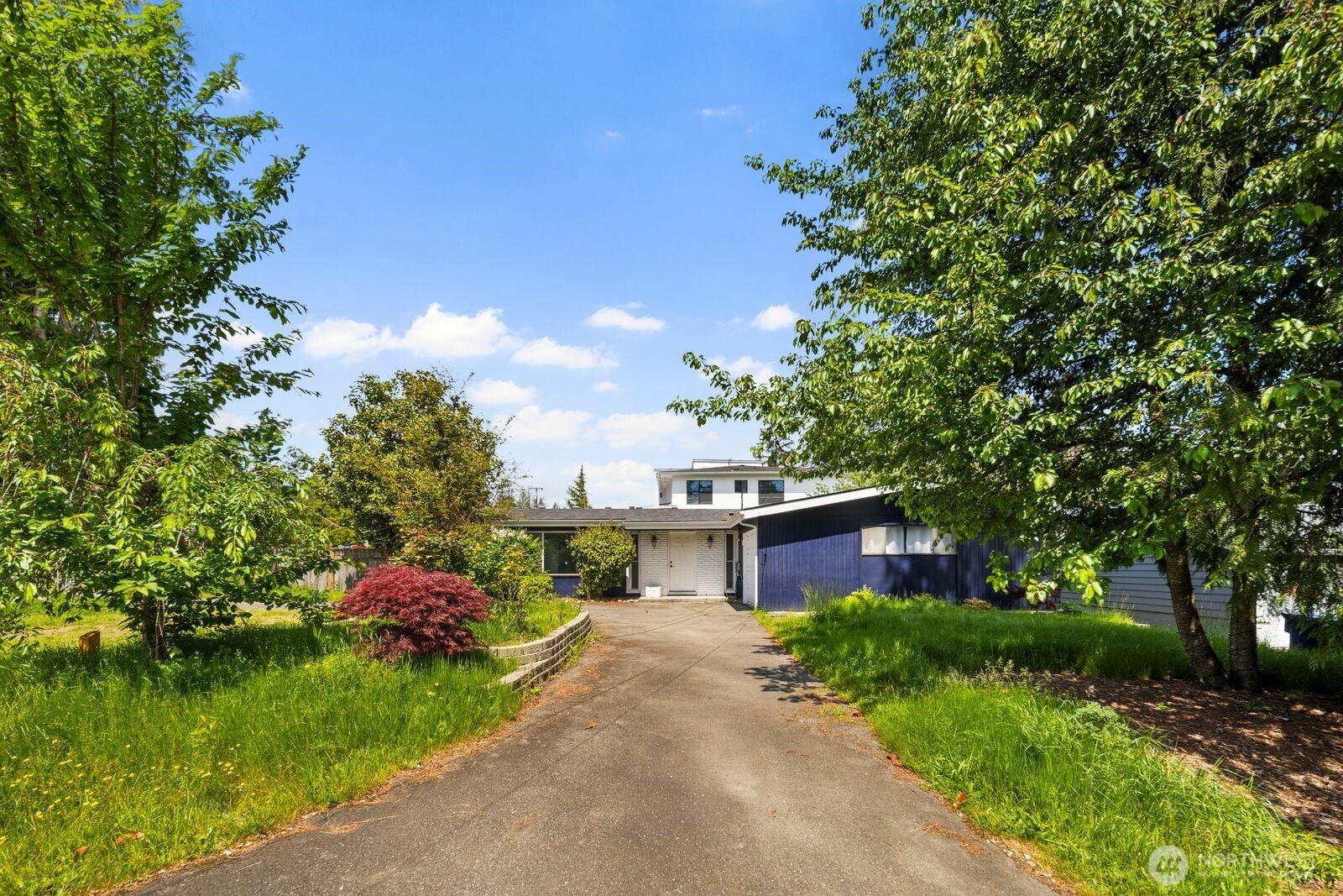 101 161st Street Southeast Bothell, WA 98012 - Photo 33 of 34 a front view of a house with a garden and yard
