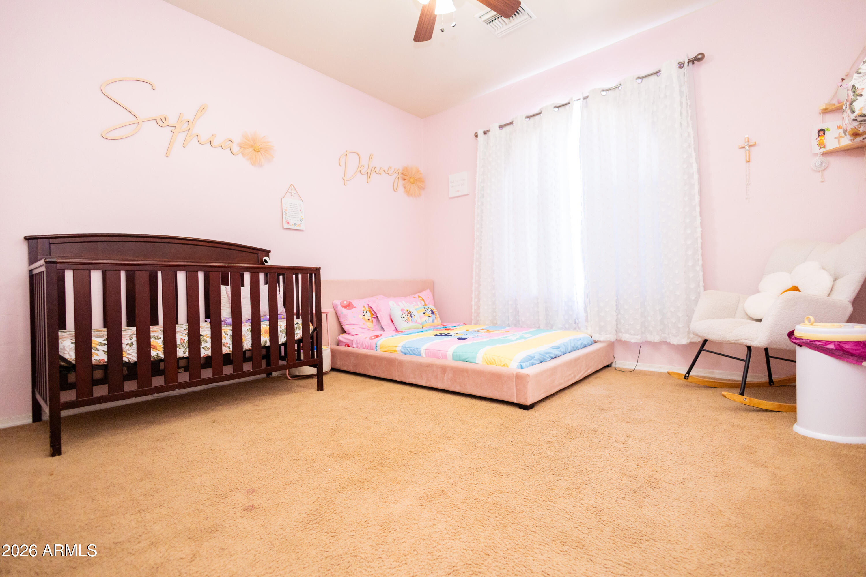 2705 East 7th Street Douglas, AZ 85607 - Photo 8 of 19 a bed room with a bed and a chair
