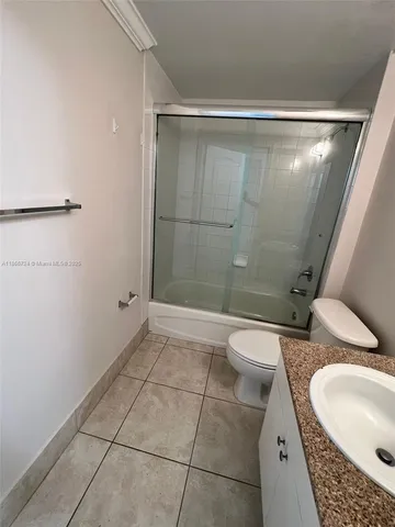 a view of a livingroom with an empty space and a window