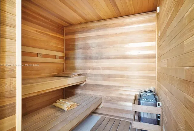 a lobby with furniture and a potted plant