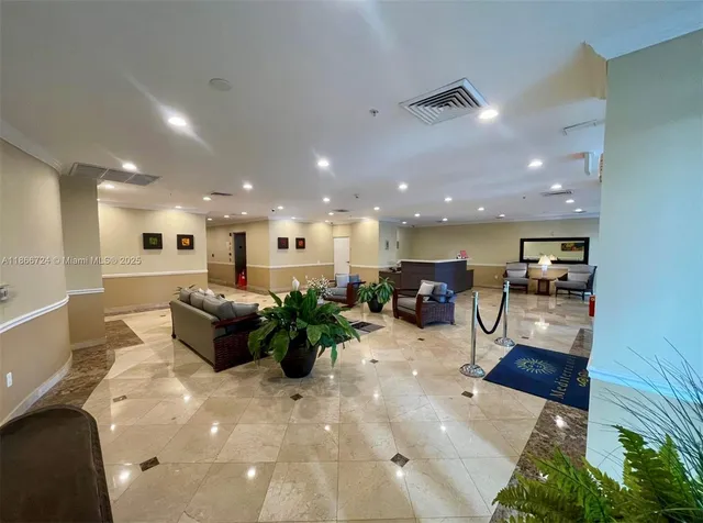 a large kitchen with a large counter top furniture appliances and a potted plant