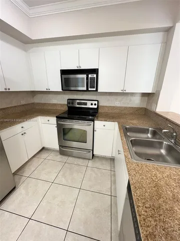 a view of an empty room and a window