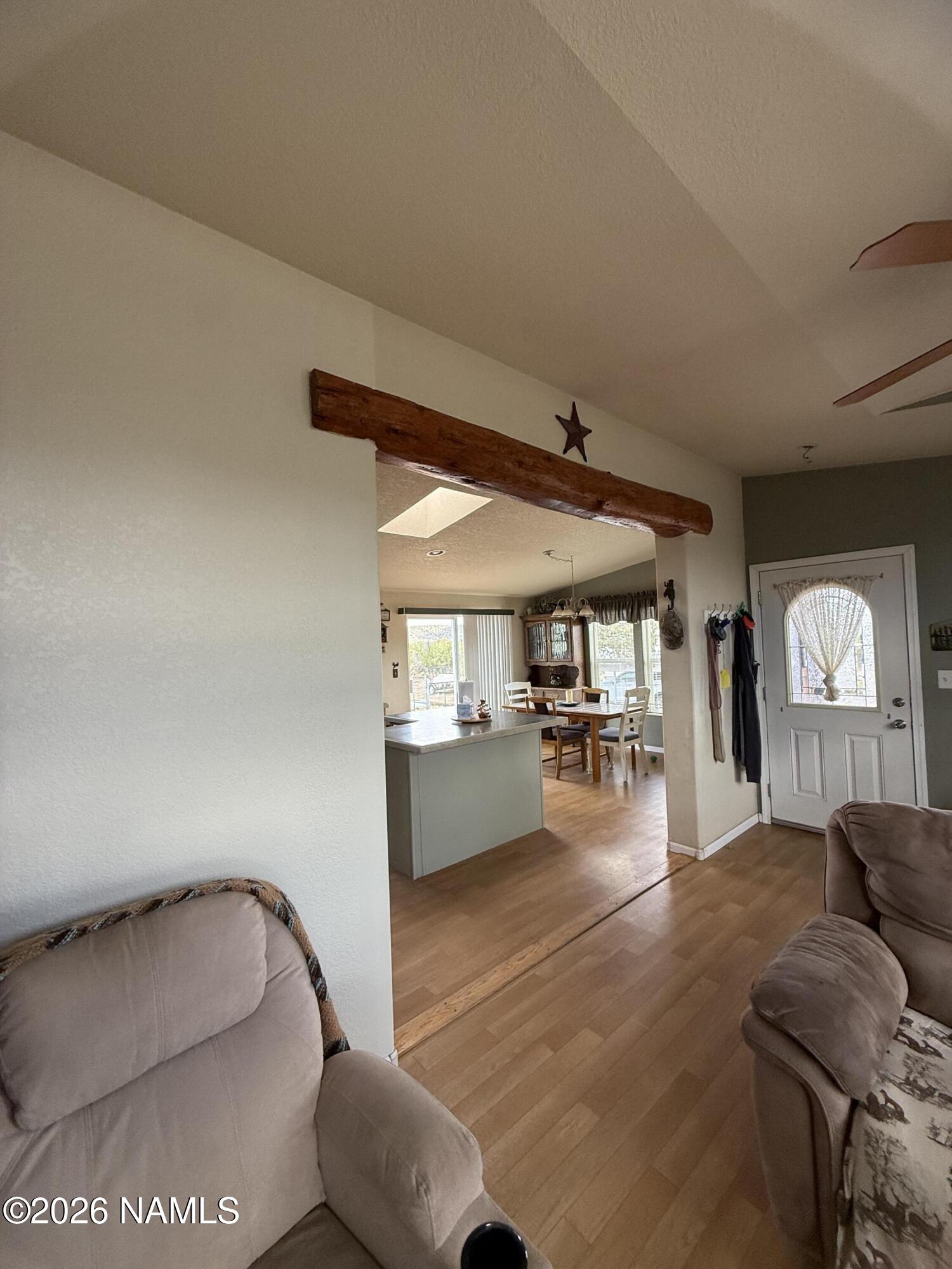 1431 East Cedar Road Williams, AZ 86046 - Photo 19 of 51 a living room with furniture and a dining table