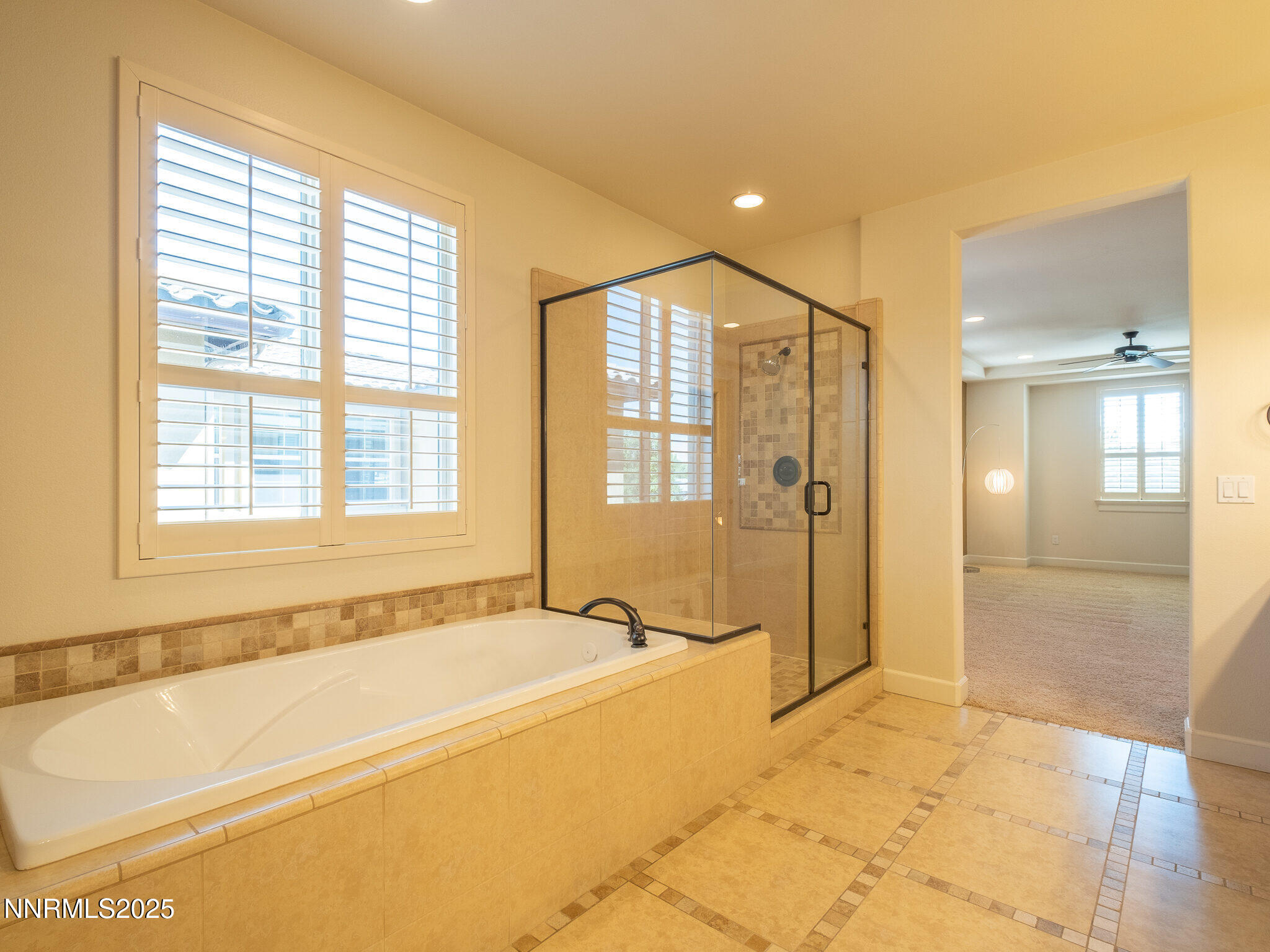 3985 San Donato Loop Reno, NV 89519 - Photo 12 of 29 a spacious bathroom with a large tub shower and sink