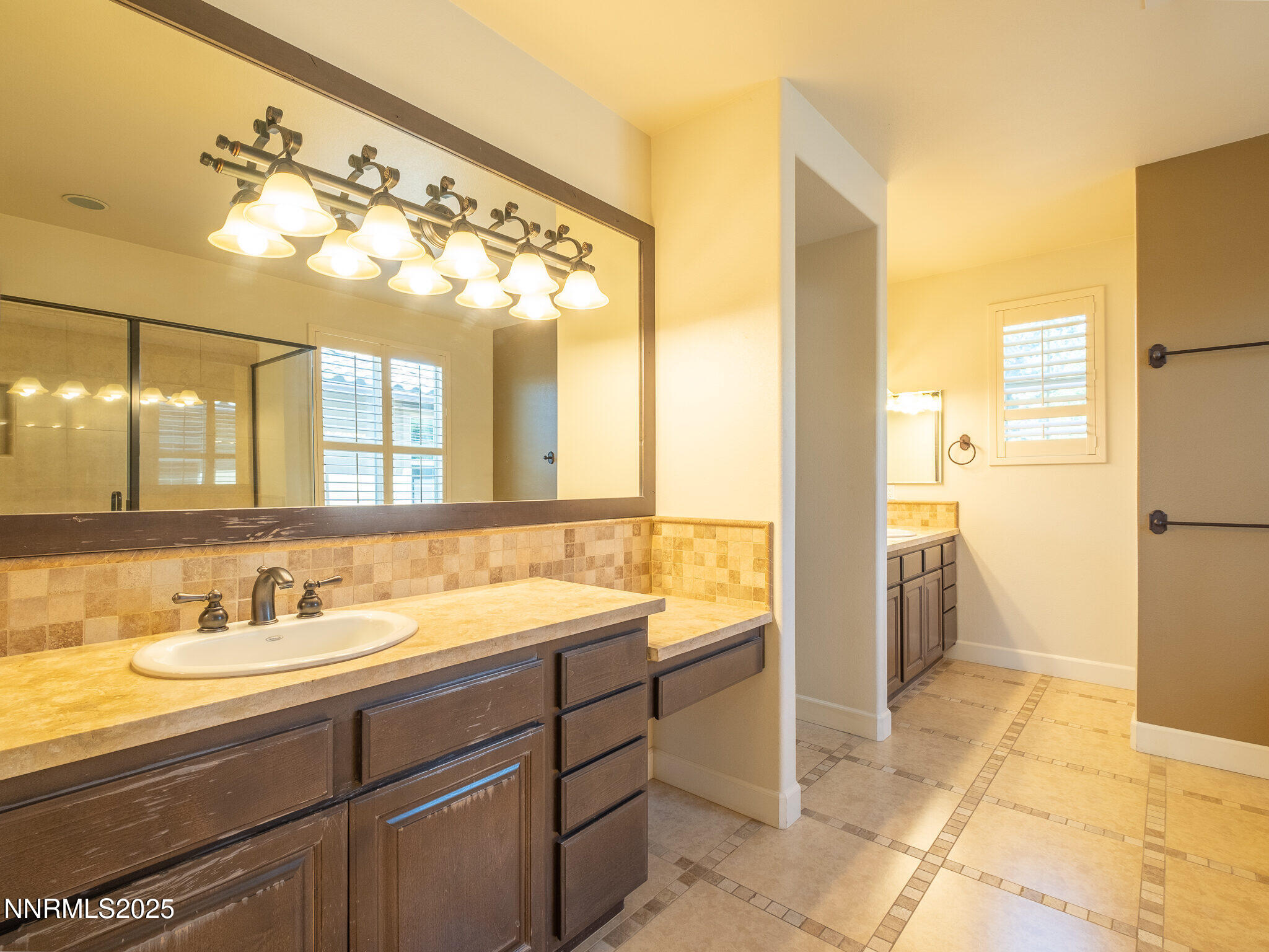 3985 San Donato Loop Reno, NV 89519 - Photo 13 of 29 a bathroom with a sink and a mirror