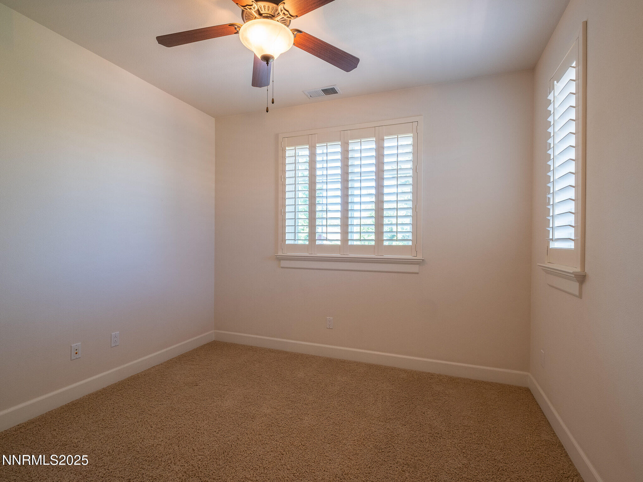 3985 San Donato Loop Reno, NV 89519 - Photo 17 of 29 an empty room with windows and fan