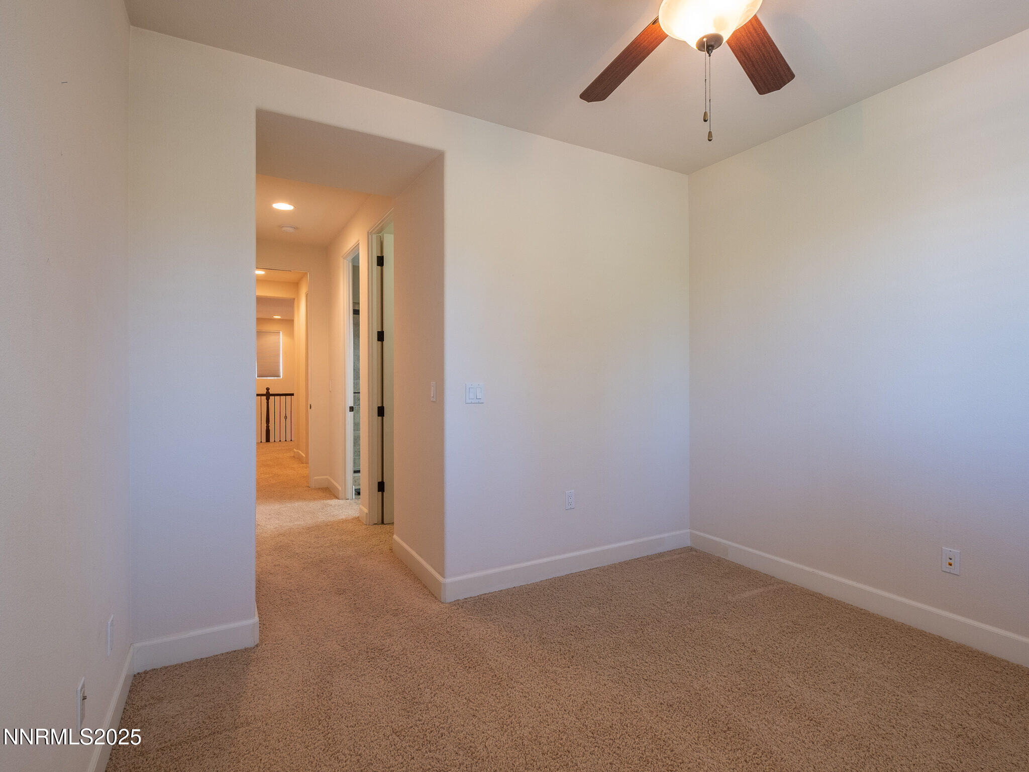 3985 San Donato Loop Reno, NV 89519 - Photo 19 of 29 an empty room with a empty space and a ceiling fan