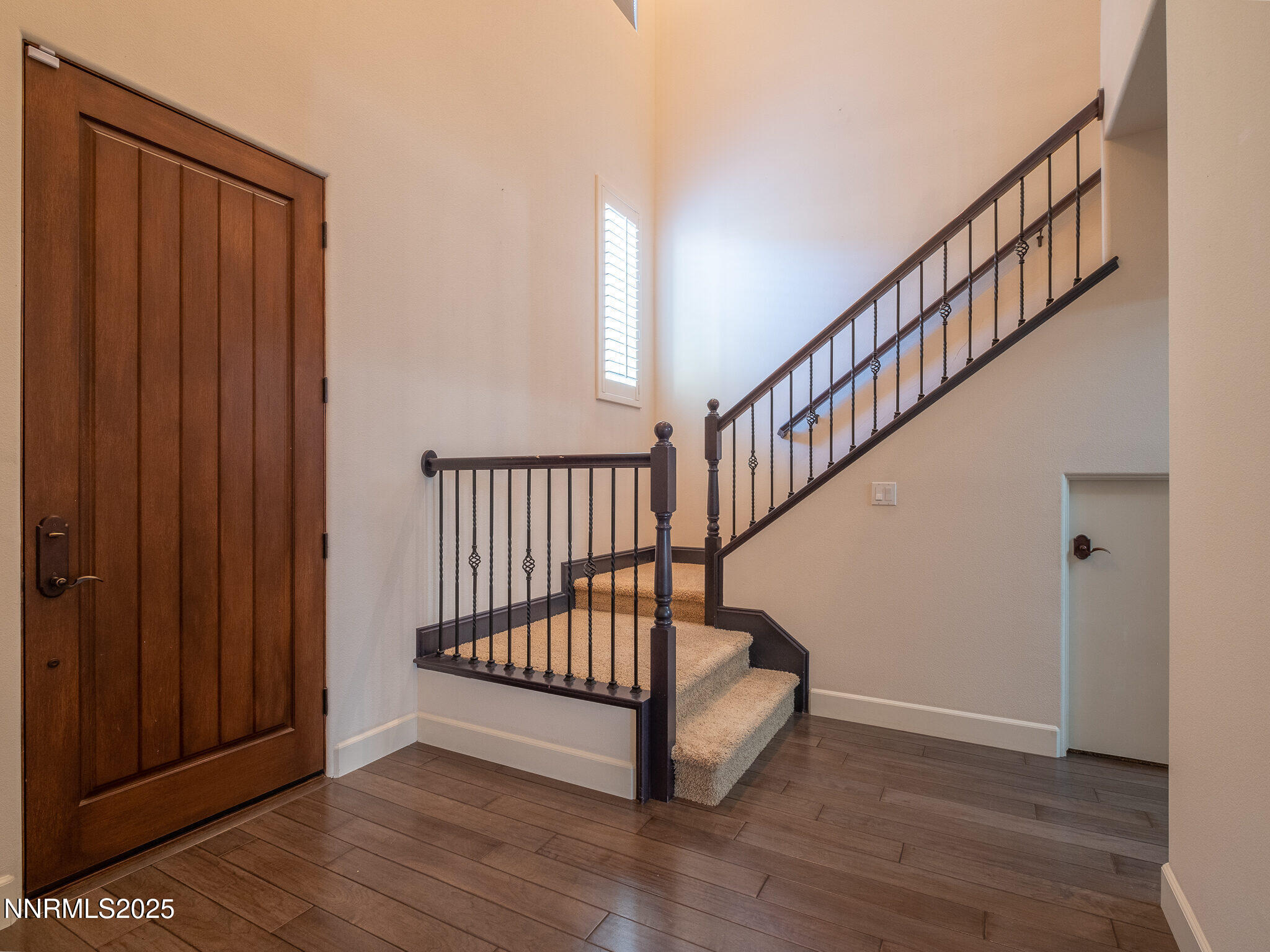 3985 San Donato Loop Reno, NV 89519 - Photo 2 of 29 a view of entryway with wooden floor and stairs