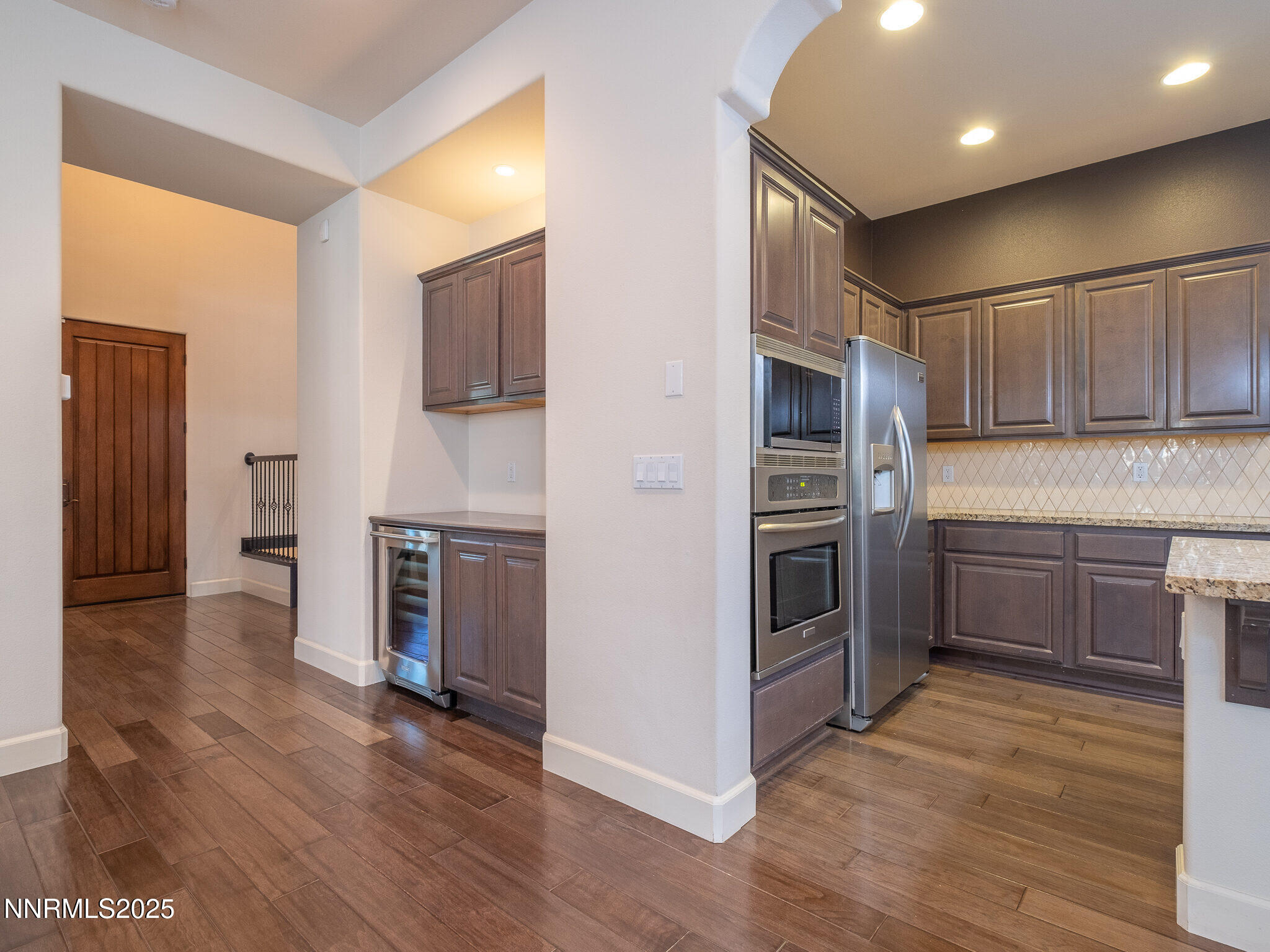 3985 San Donato Loop Reno, NV 89519 - Photo 24 of 29 a kitchen with stainless steel appliances granite countertop a refrigerator and a stove top oven