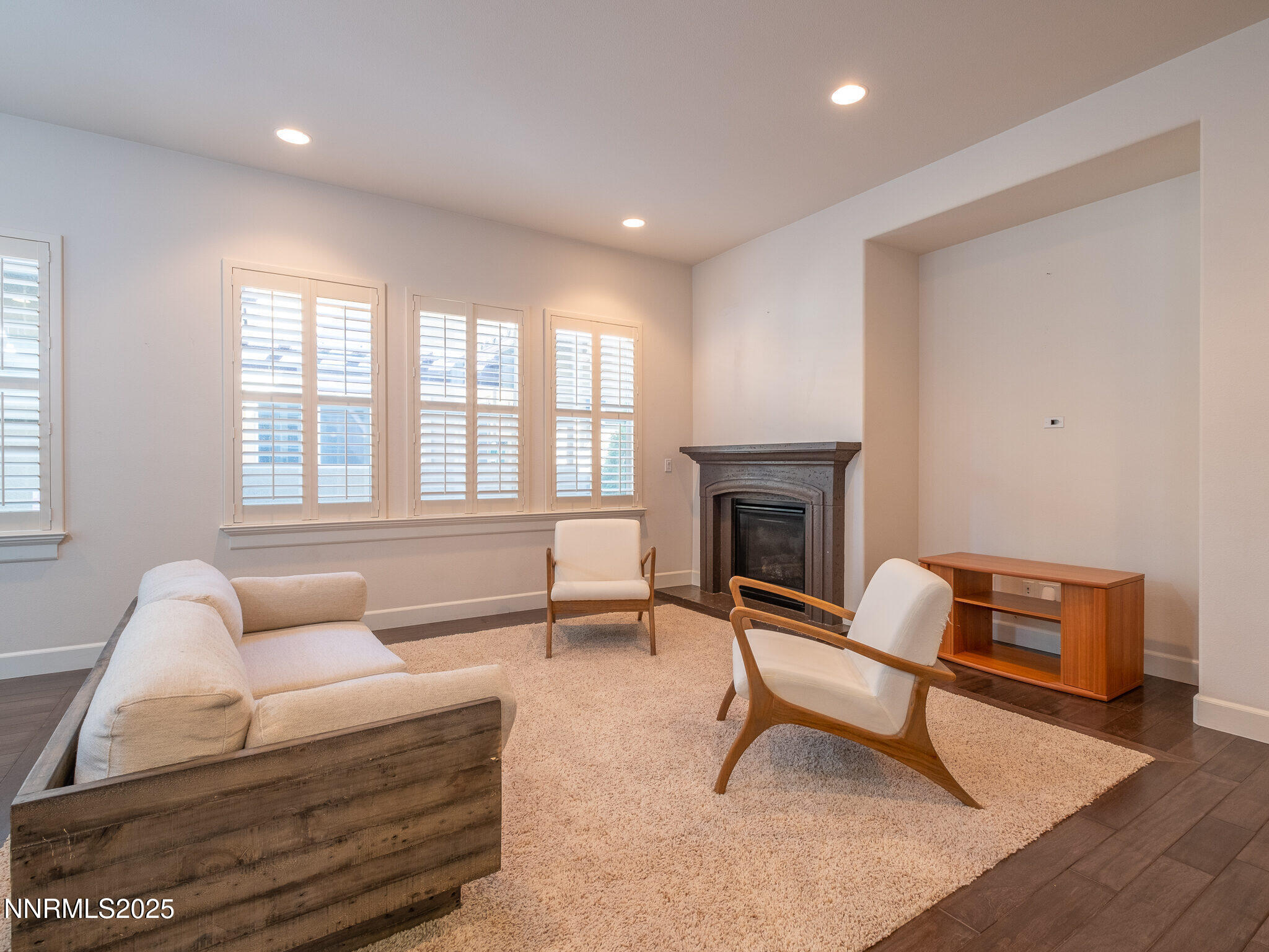 3985 San Donato Loop Reno, NV 89519 - Photo 4 of 29 a living room with furniture and a fireplace