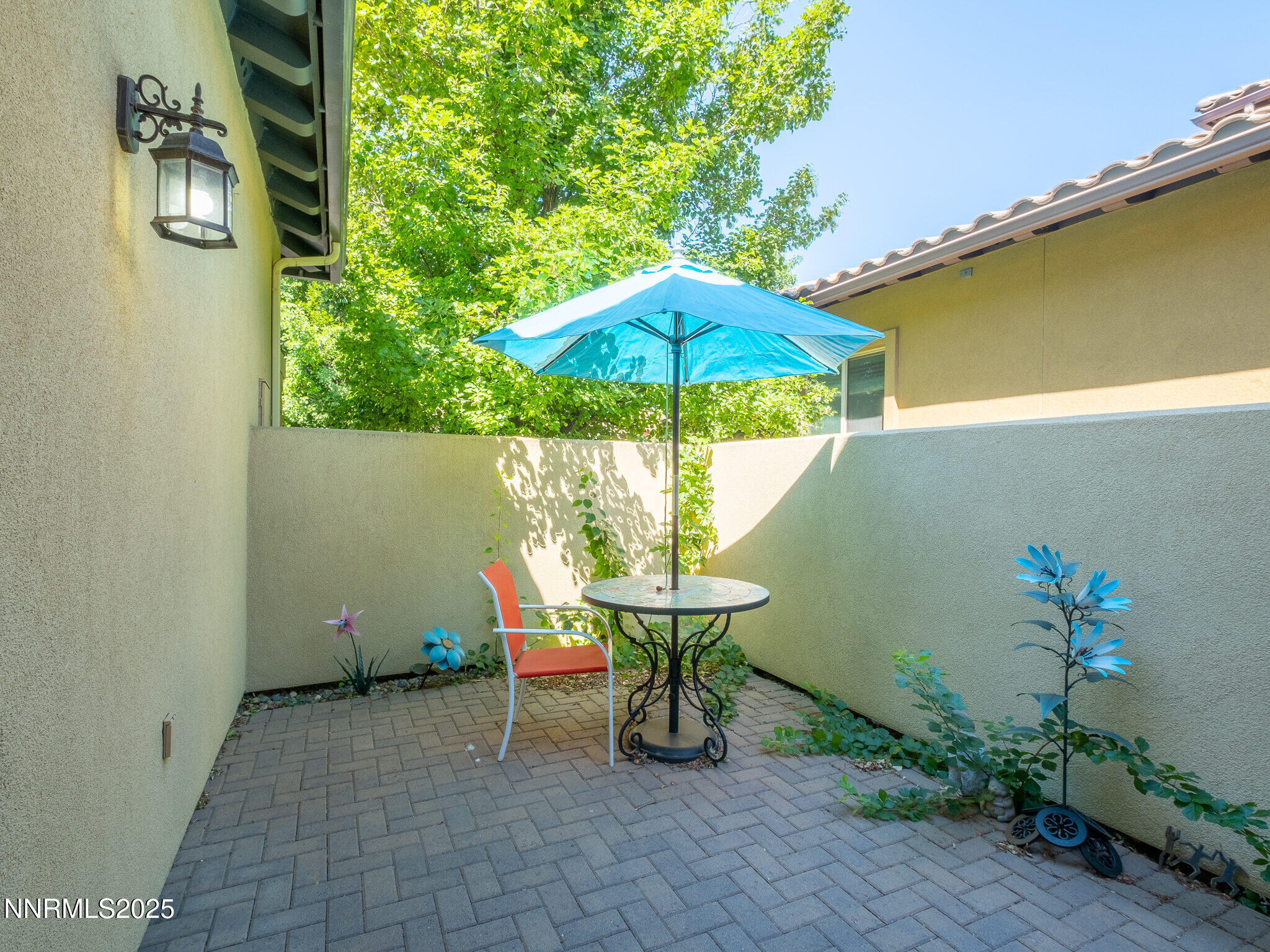 3985 San Donato Loop Reno, NV 89519 - Photo 9 of 29 an outdoor space with furniture and umbrella